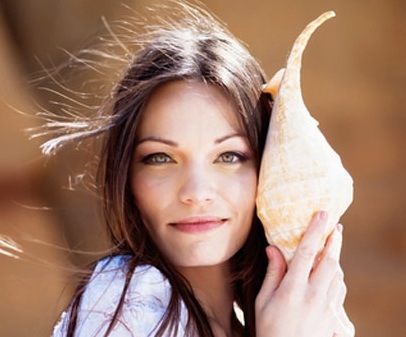  Girl listening with shell,   